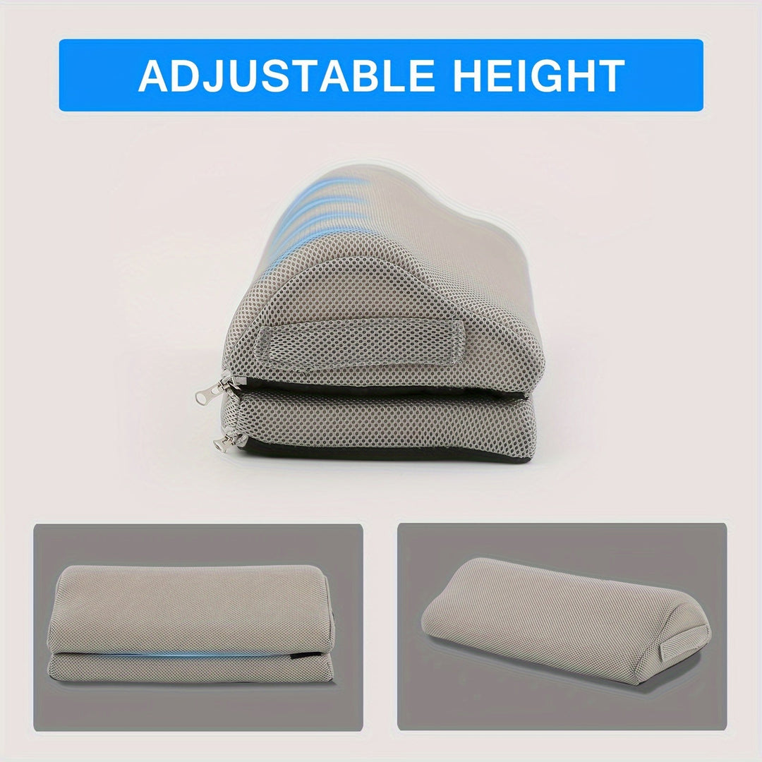 User's feet resting on an ergonomic memory foam footrest under a desk
