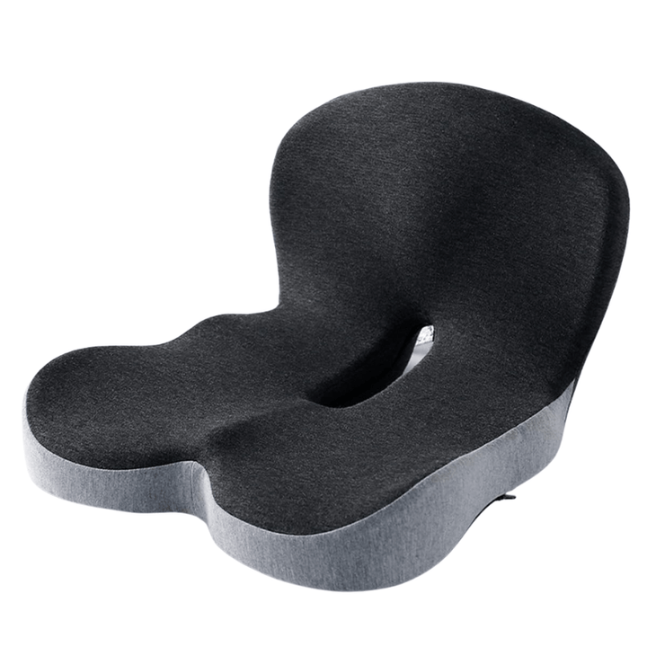 Person sitting comfortably on an ergonomic memory foam cushion