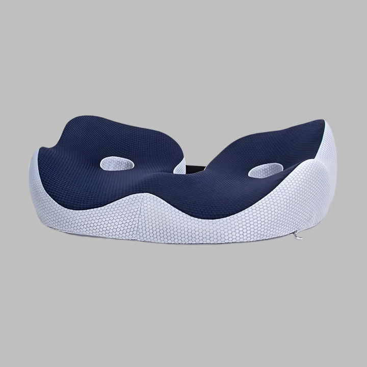 Ergonomic memory foam seat cushion providing tailbone and sit bone pain relief.