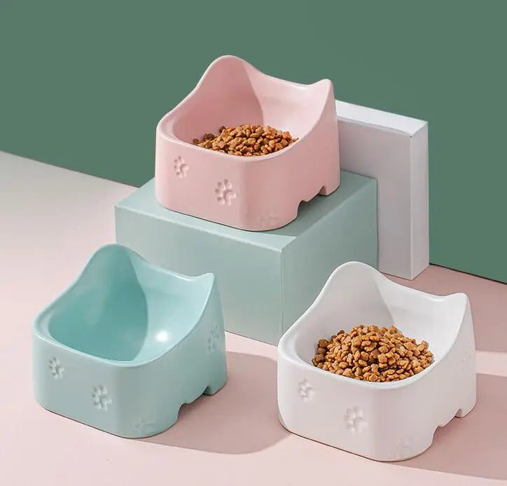 White modern raised cat feeding bowl. Ergonomic, non-slip design for comfortable, healthy eating. Easy to clean.