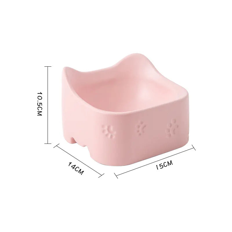 Ergonomic cat food and water bowl. Raised non-slip design promotes healthy eating for felines. Pet accessory.