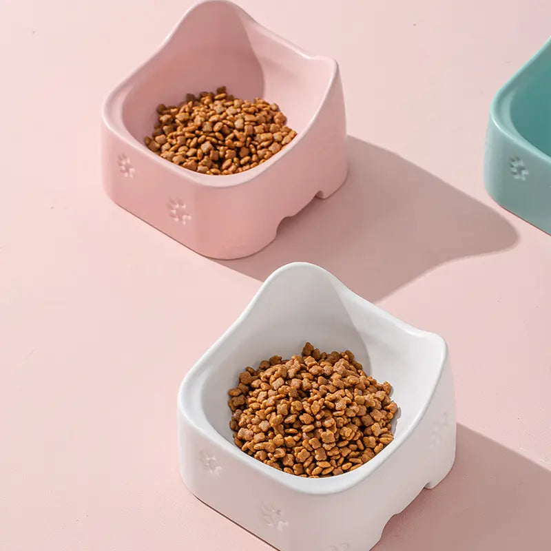 Green, Pink, White ergonomic raised cat bowls. Non-slip base, easy clean, promotes healthy eating for all cats.
