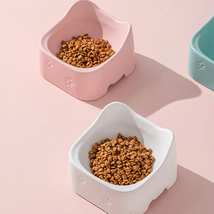 Green, Pink, White ergonomic raised cat bowls. Non-slip base, easy clean, promotes healthy eating for all cats.