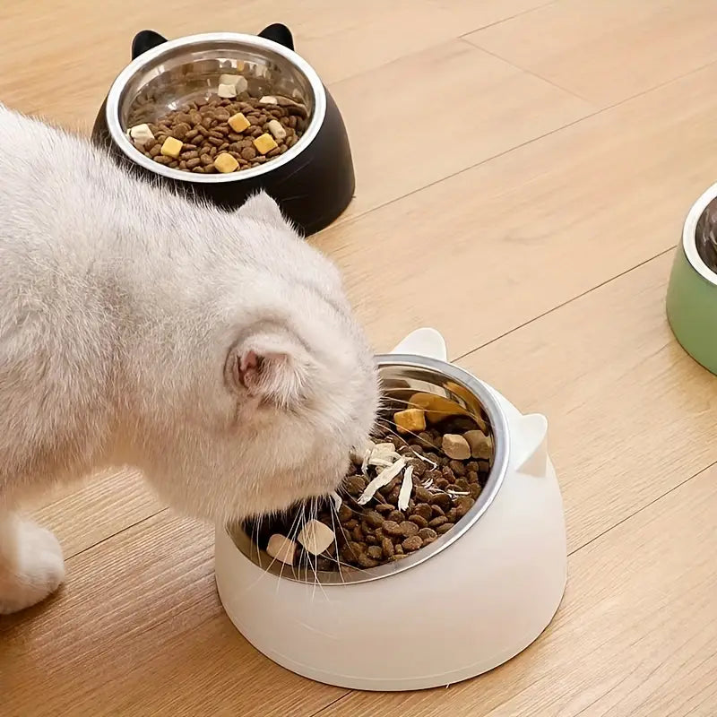 Ergonomic raised cat food bowl in light blue for comfortable feeding.