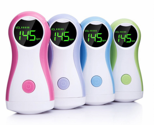 Expectant mother using a homeuse fetal heartbeat monitor, bonding with her baby prenatally.
