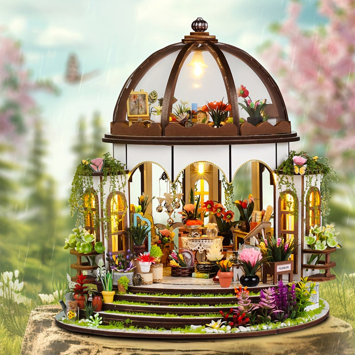 Hands assembling a section of the miniature flower house 3D wooden puzzle, highlighting the DIY hobby kit experience.