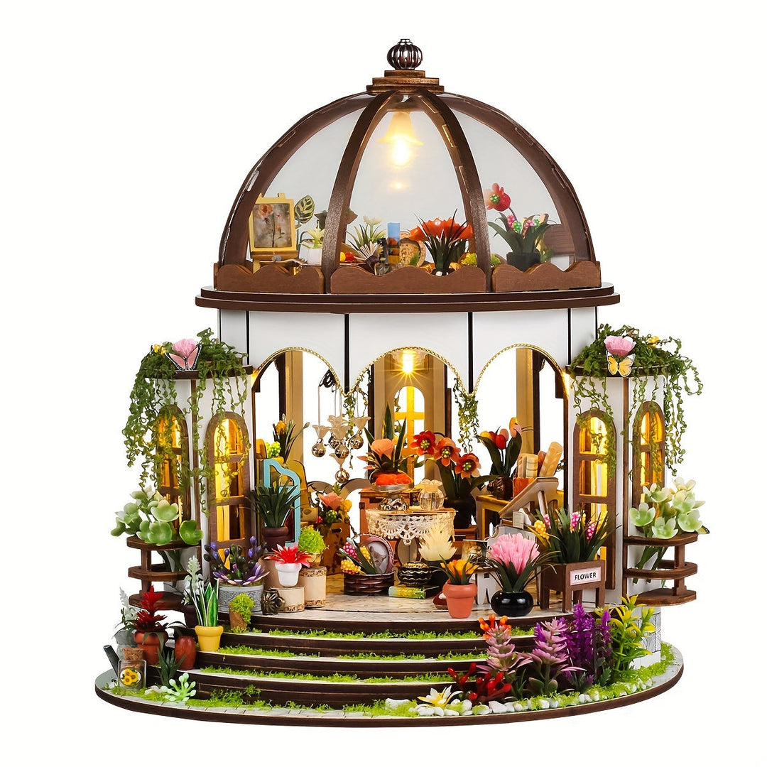 Close-up of the miniature flower house interior with warm LED lighting, creating a cozy glow in the wooden model.