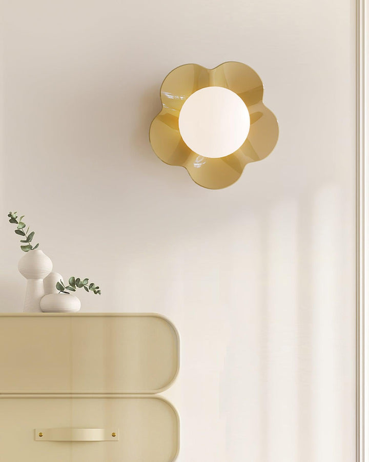 Unique floral resin wall lamp, glass shade, for indoor illumination.