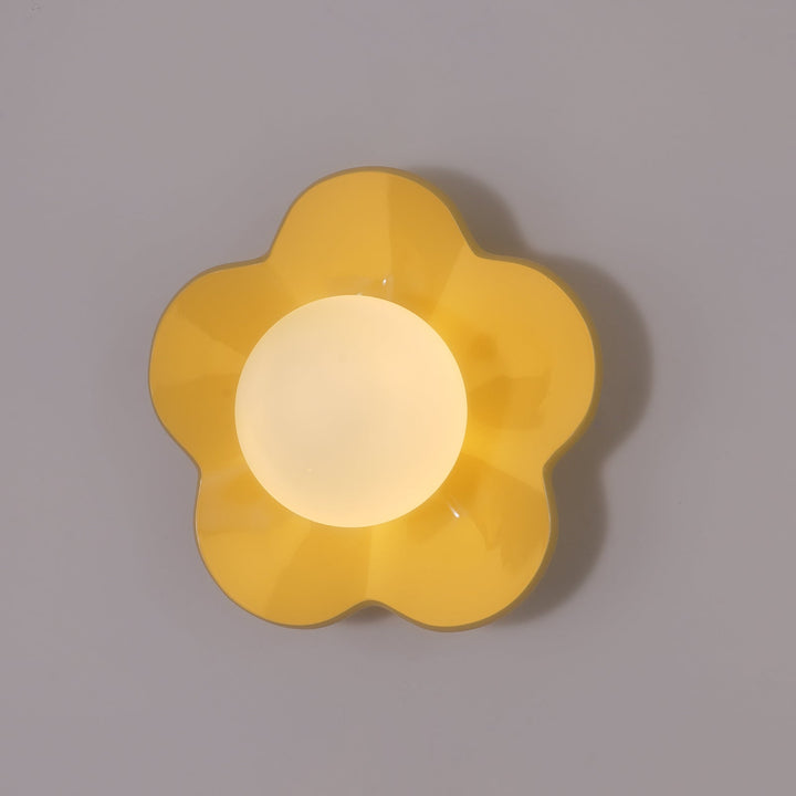 Floral resin ceiling light with delicate glass shade, modern indoor decor.