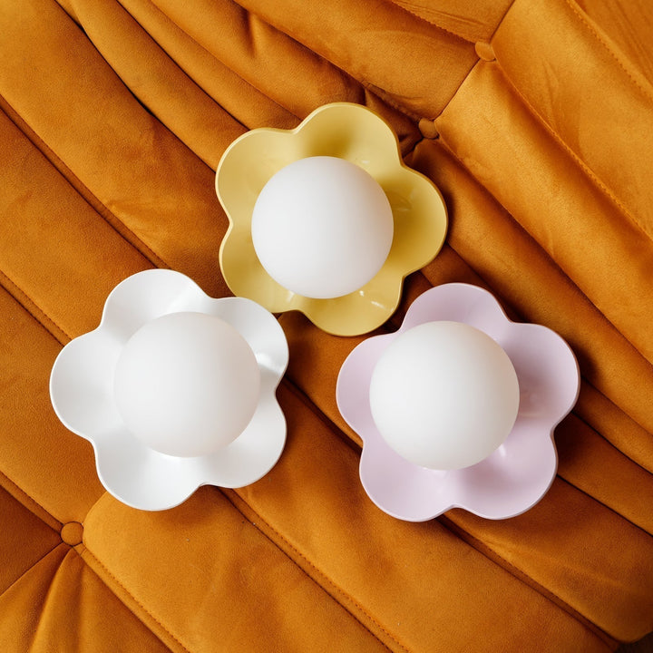 Artistic floral resin ceiling light with frosted glass, home accent.