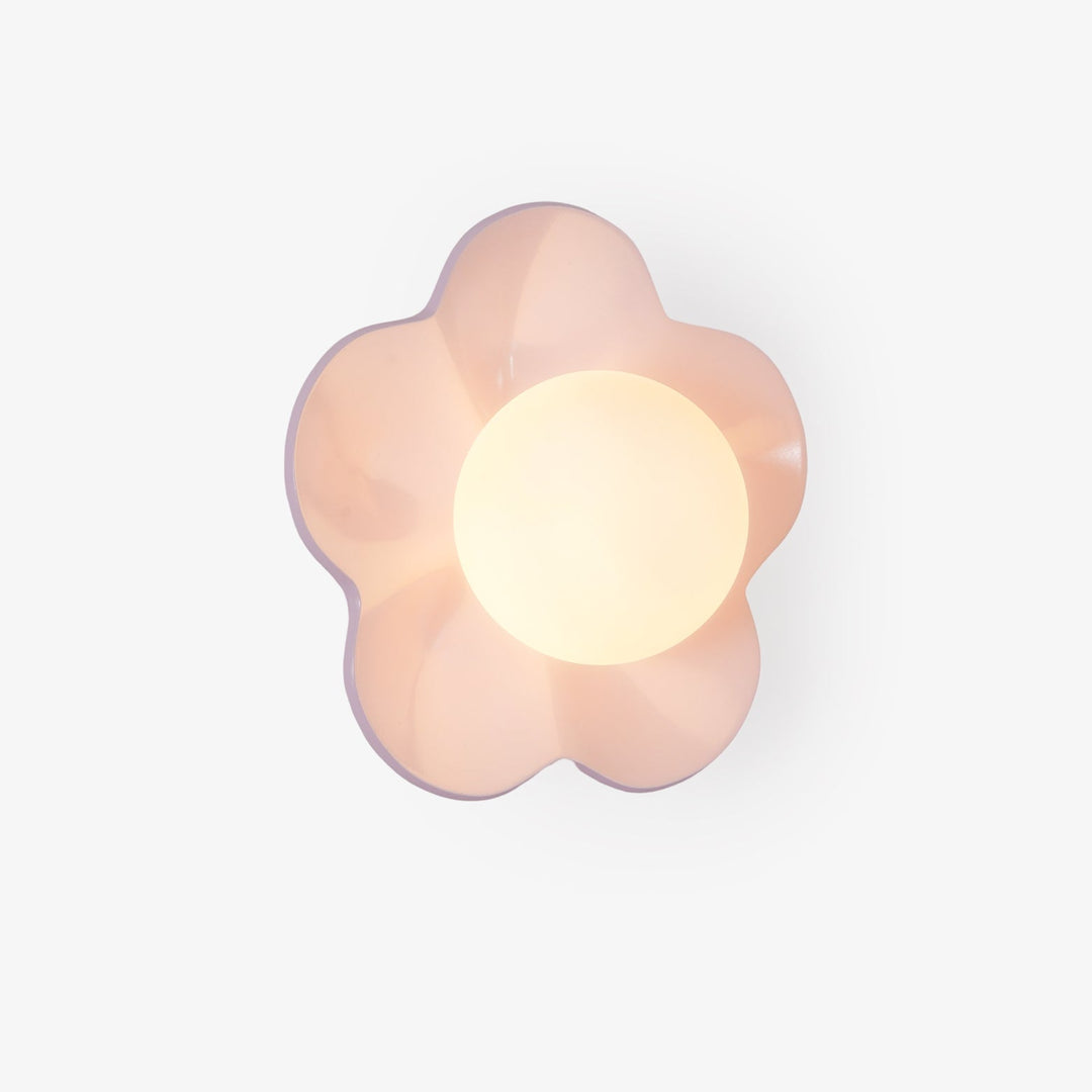 Intricate floral resin detail on a glass shade wall or ceiling lamp.