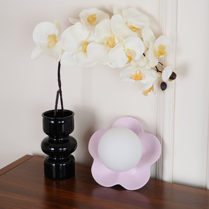 Floral resin base with a round glass shade wall or ceiling lamp.