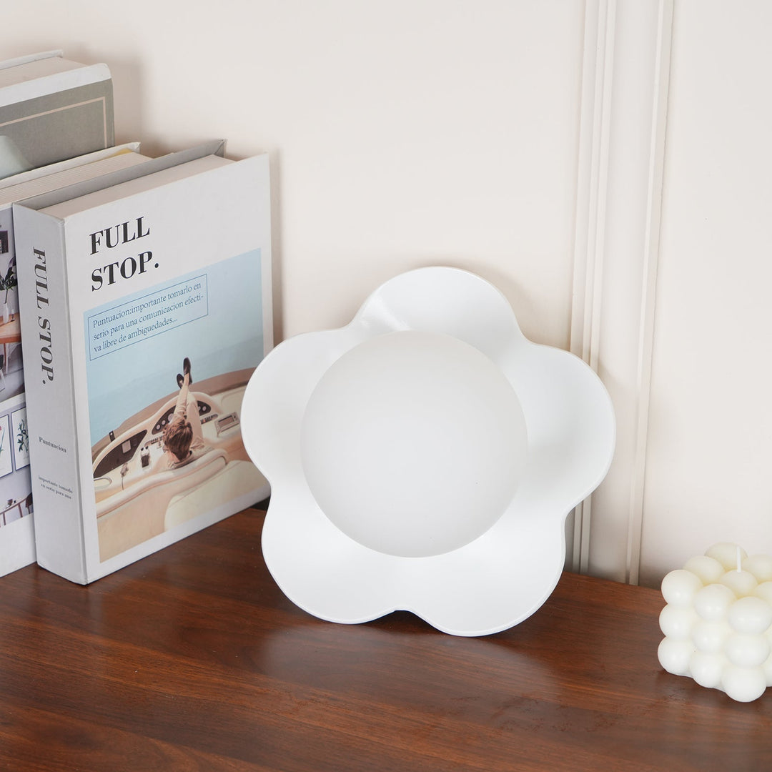 Decorative resin lamp with floral design & glass diffuser.