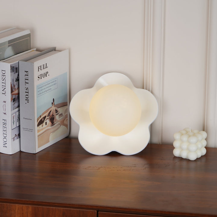Stylish indoor floral lamp, resin petals, glass globe, wall/ceiling.