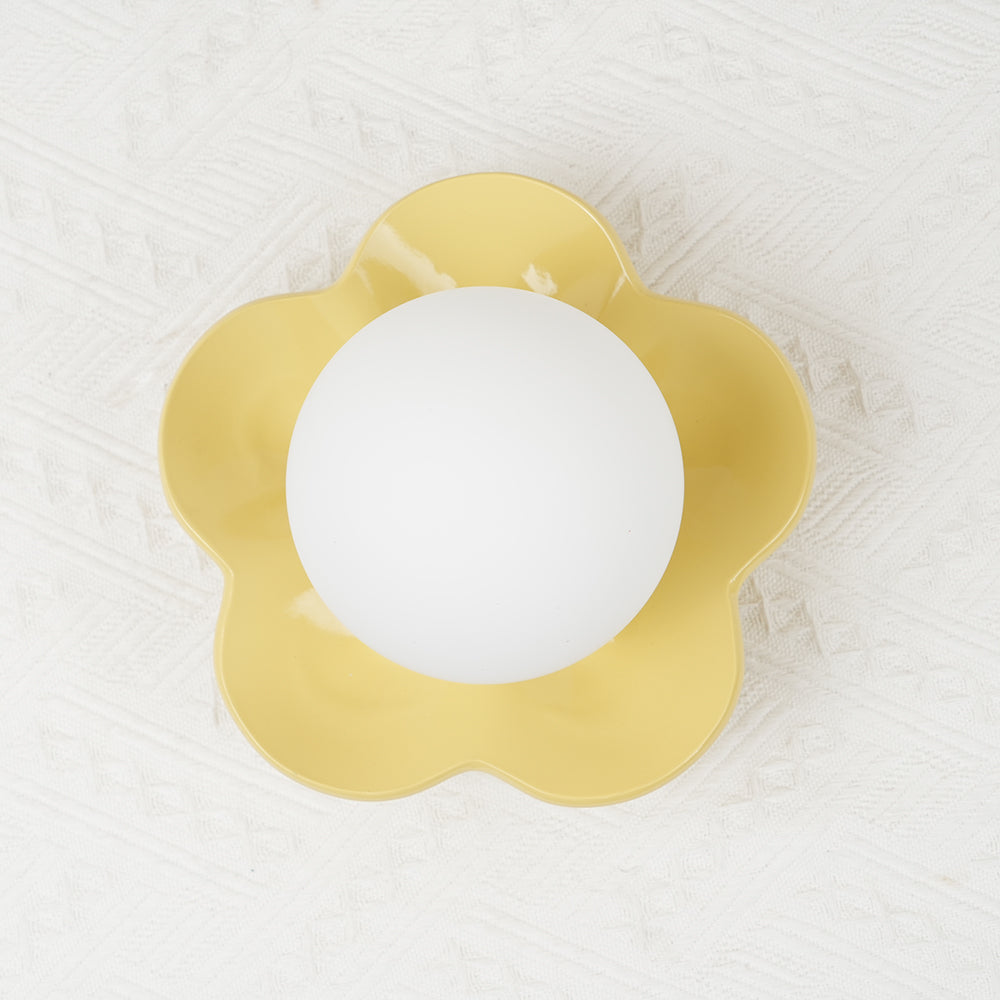 Sophisticated floral design resin wall/ceiling light with glass accents.