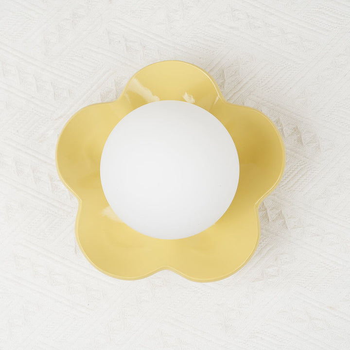 Sophisticated floral design resin wall/ceiling light with glass accents.