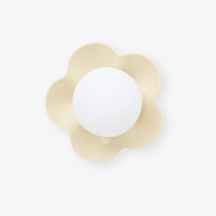 Modern floral resin wall/ceiling light featuring a stylish glass shade.