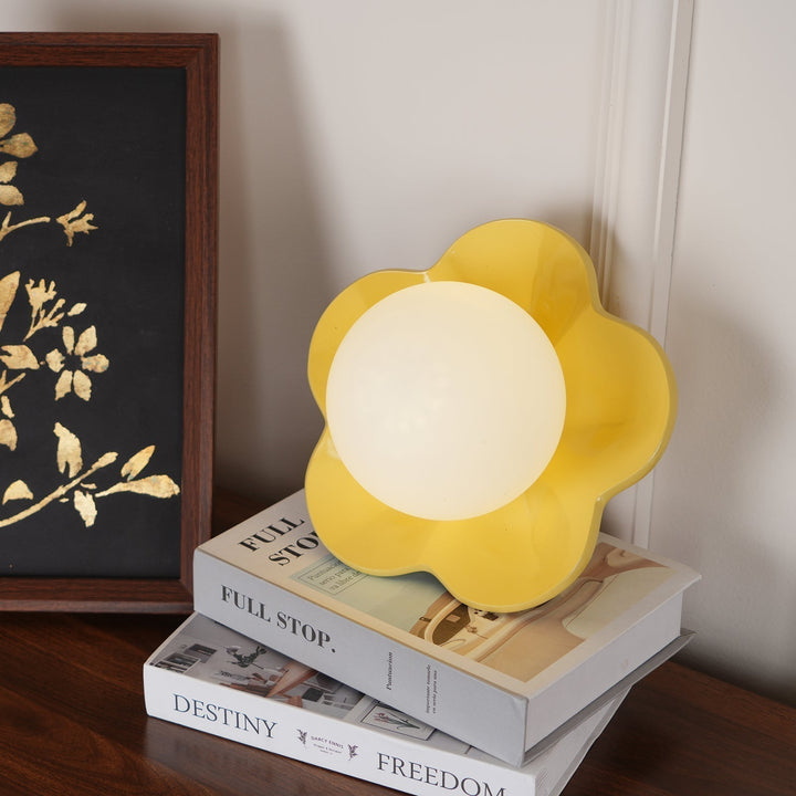 Home decor accent, floral resin wall lamp with frosted glass.