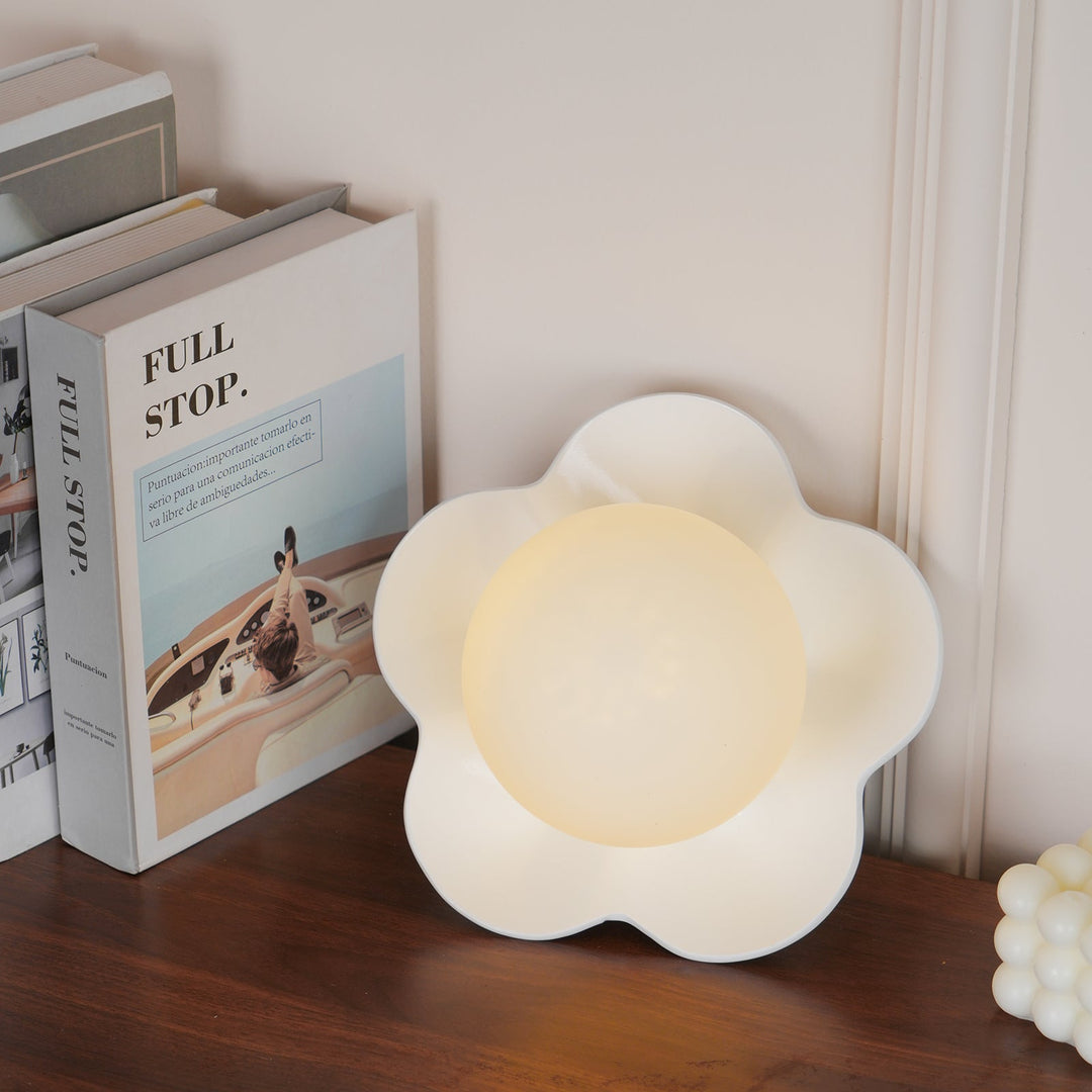 Contemporary floral resin & glass wall light, artistic design.