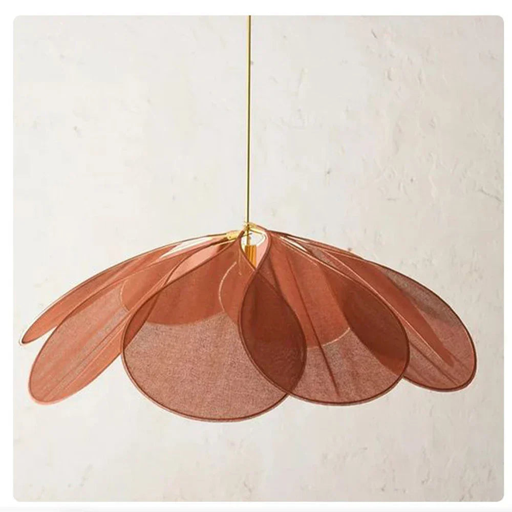 Intricate flower-shaped fabric pendant lamp, creating a warm, natural ambient glow for home decor.