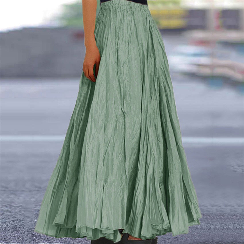 Elegant women's flowy pleated skirt, elastic waist for versatile fashion.
