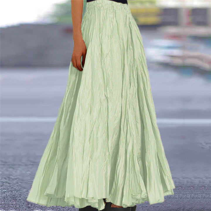 Summer-ready women's long pleated skirt, flowy fabric & elastic waist.