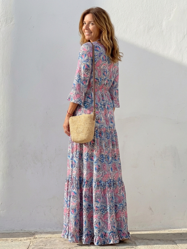 Women's casual flowy bohemian maxi dress with V-neck & long sleeves, ideal for travel or summer outings.