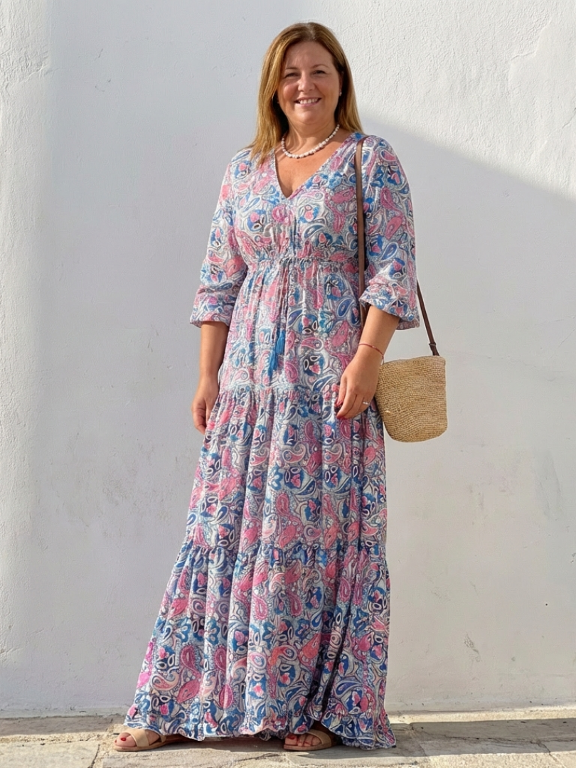 Soft, flowy bohemian maxi dress with vibrant paisley print, V-neck, and long sleeves for women's comfort.