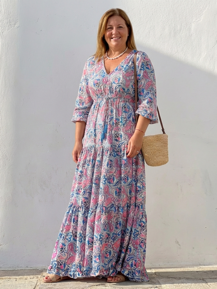 Soft, flowy bohemian maxi dress with vibrant paisley print, V-neck, and long sleeves for women's comfort.