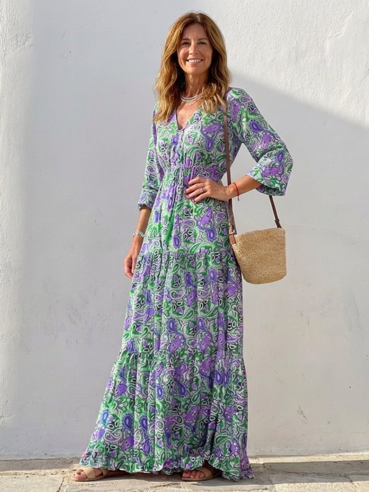 Women's elegant long sleeve V-neck bohemian maxi dress, flowy fit, featuring a chic paisley pattern.