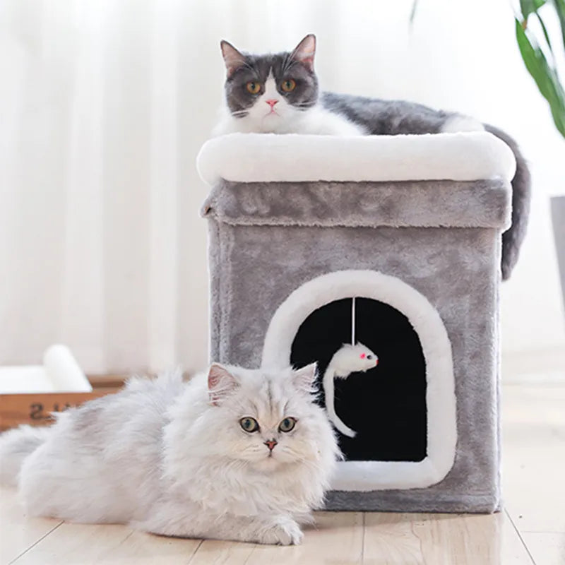 Foldable cat cave bed with a soft lying surface and an attached toy. Ideal pet furniture for comfort & play.