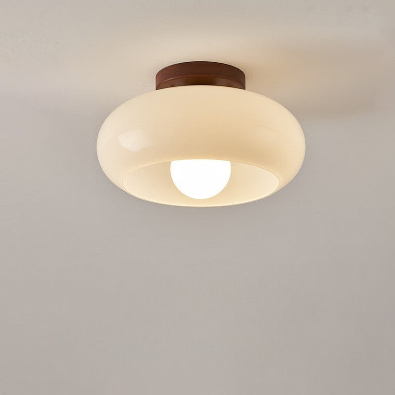 Opal glass ceiling lamp in Bauhaus design, showcasing a stylish wood accent for contemporary homes.