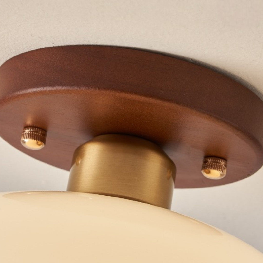 Bedroom ceiling light with French Bauhaus influence, offering soft, warm illumination and a wooden element.