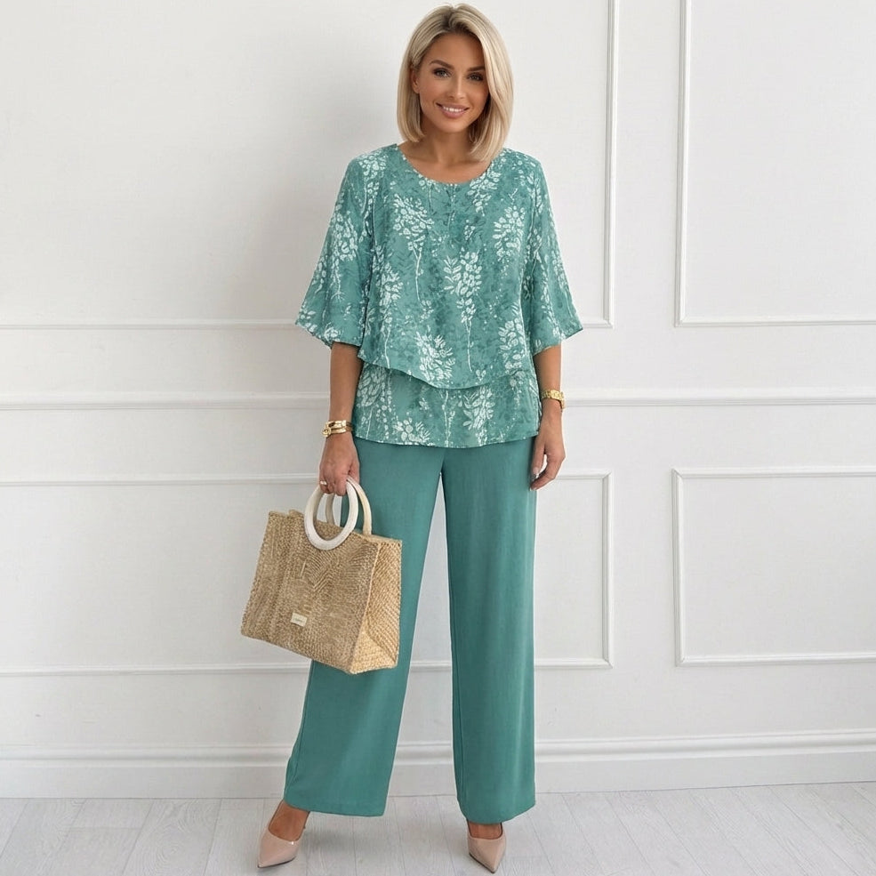 Fresh teal floral two-piece outfit for women, featuring a flowy top & wide-leg pants. Perfect summer co-ord set.
