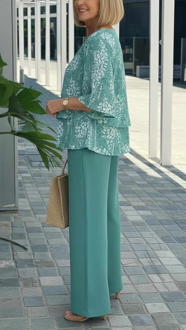 Comfortable women's teal floral two-piece set, featuring a flowy top & wide-leg pants. Ideal for casual summer fashion.