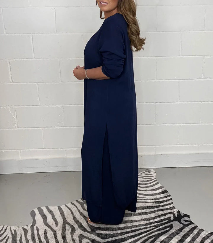 Woman modeling a comfortable relaxed fit long sleeve V-neck casual set, perfect for everyday wear.
