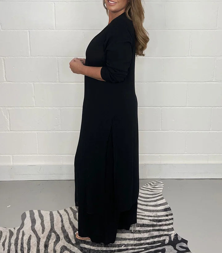 Detail of the stylish side slit on the long sleeve top of the women's two-piece loungewear set.