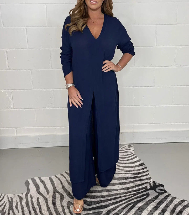 Front view of a woman wearing the relaxed V-neck long sleeve slit top and matching pants set.