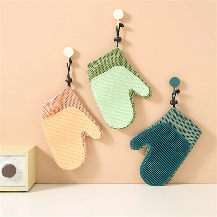 Cat grooming glove with soft silicone tips for effective de-shedding and pet massage.