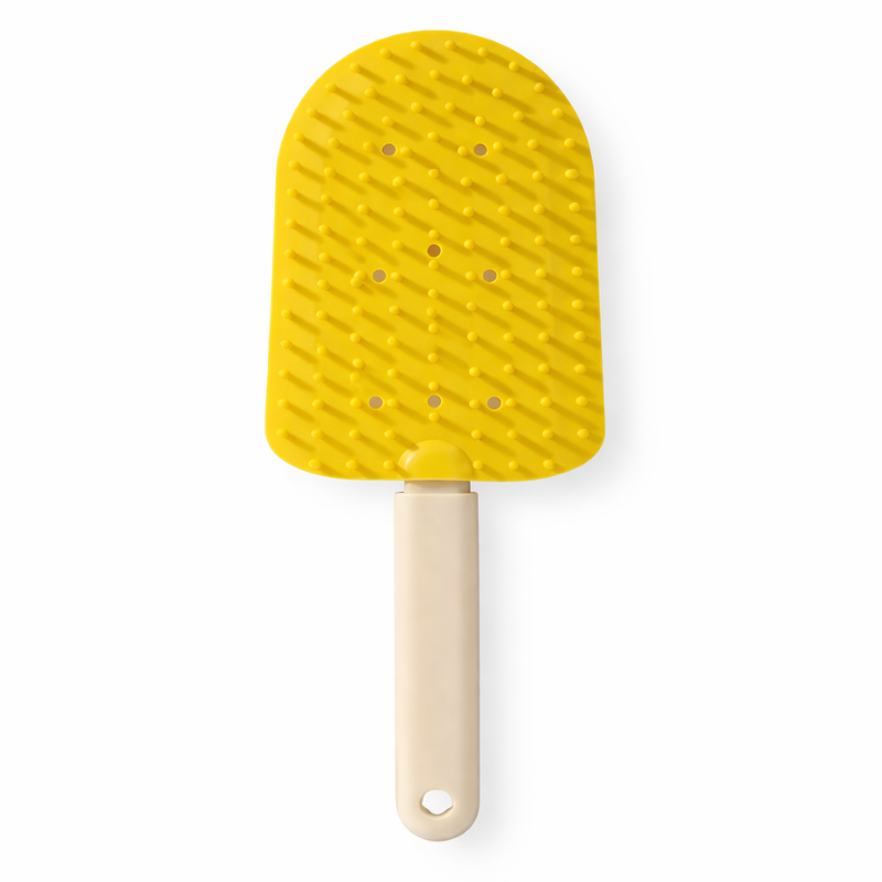 Cat grooming with a gentle deshedding brush, minimizing loose fur.