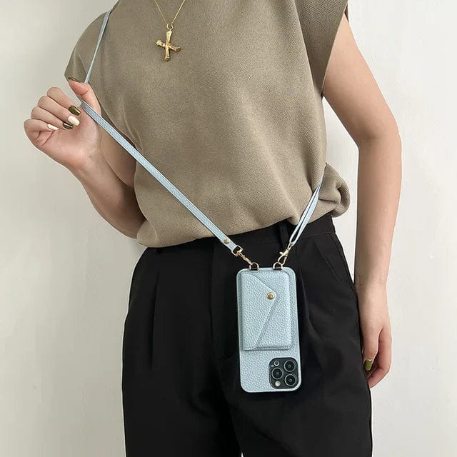 Stylish black leather phone case worn crossbody with integrated card slot and keyring