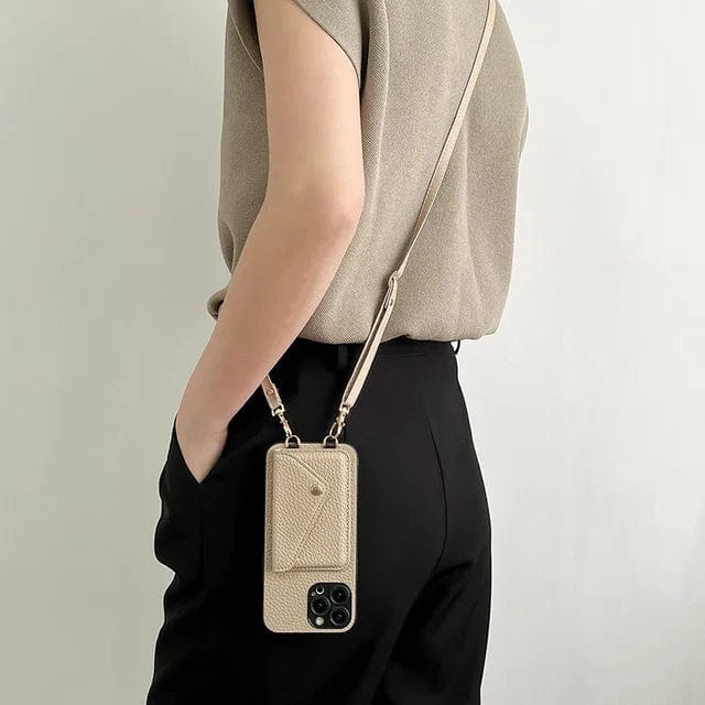 Close-up of a supple leather crossbody phone case showing card slots and key cord attachment
