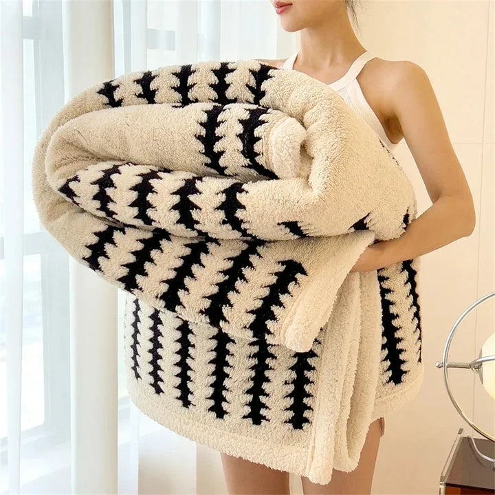Soft & warm geometric throw blanket. Reversible design with plush Sherpa fleece for cozy comfort.