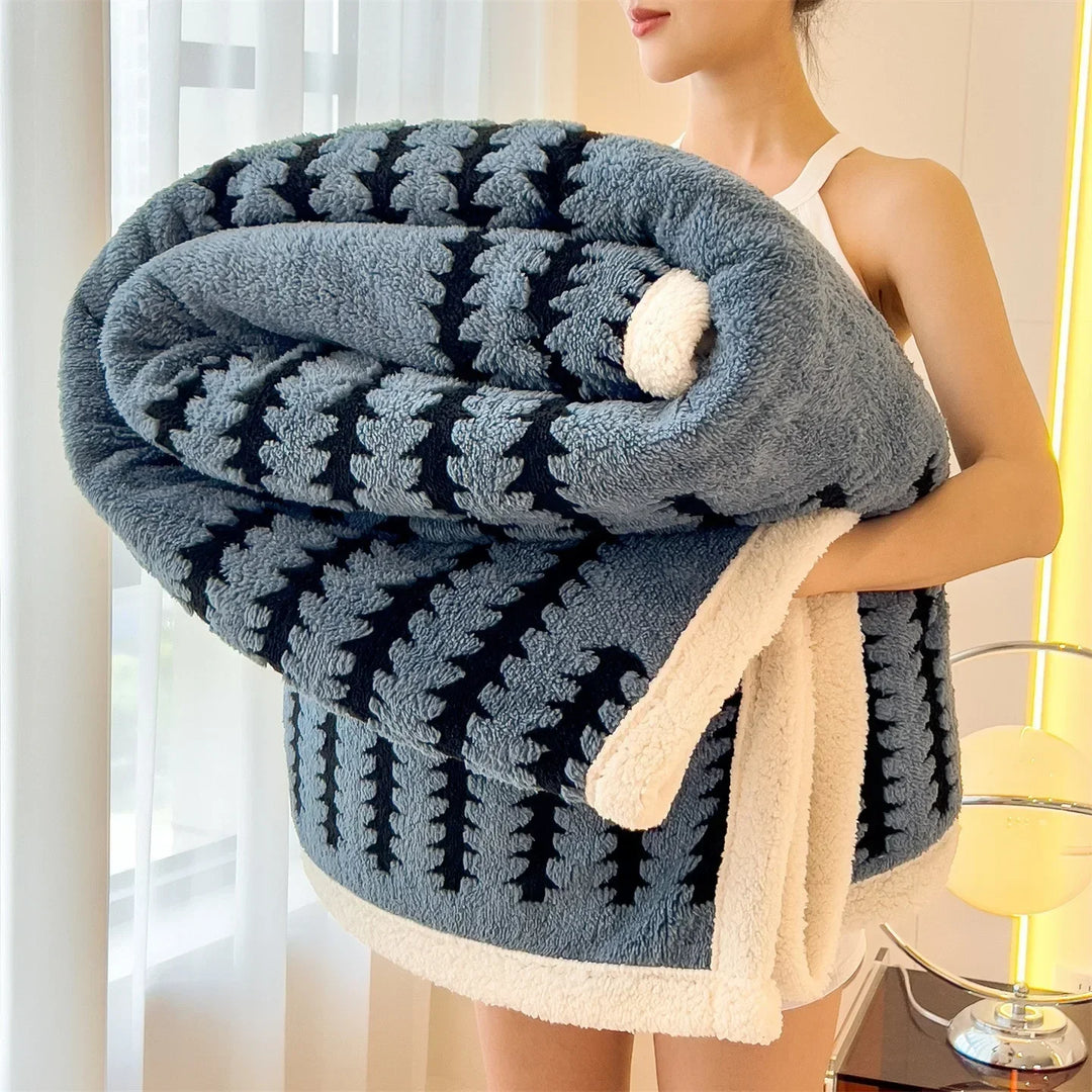 Plush geometric pattern throw blanket with soft Sherpa fleece. Reversible for versatile home decor.