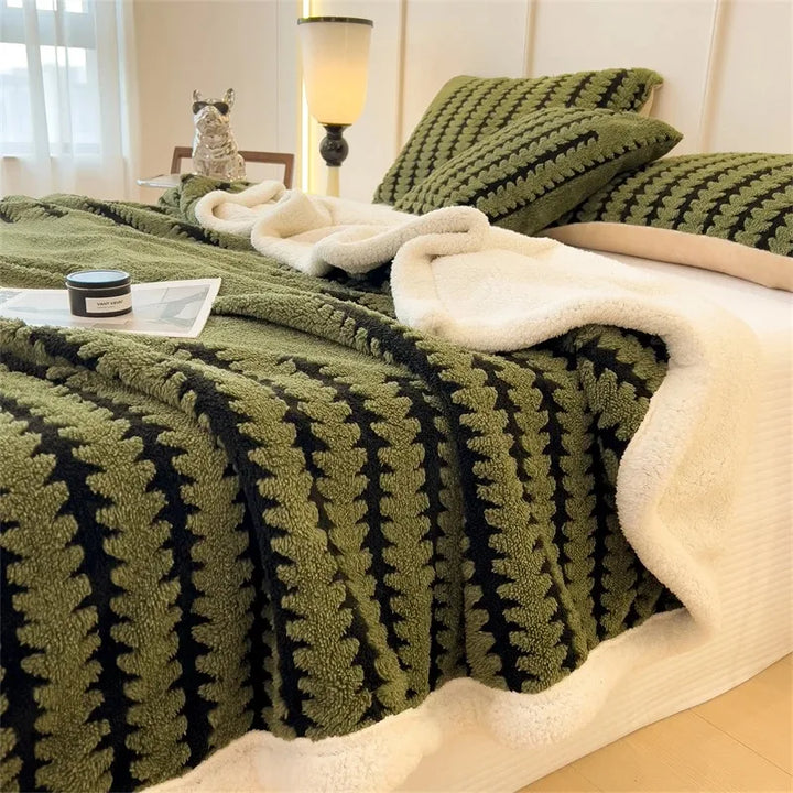 Textured geometric reversible throw blanket. Soft Sherpa fleece provides cozy, warm home decor.