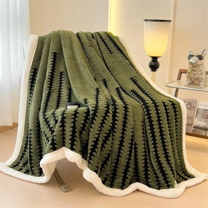 Soft geometric throw blanket, reversible with Sherpa fleece. Warm and decorative for any room accent.