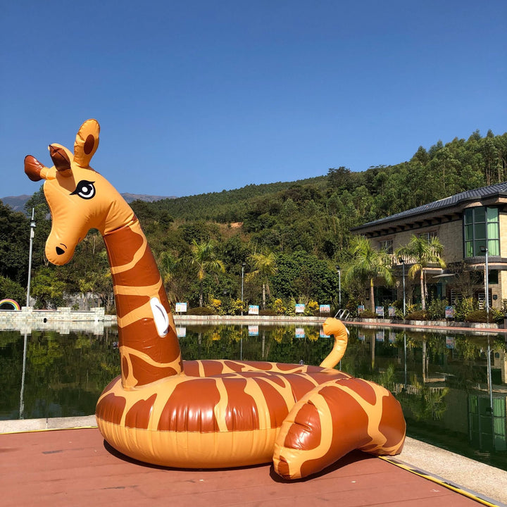 Giant inflatable giraffe pool float for unisex summer fun & relaxing pool parties.