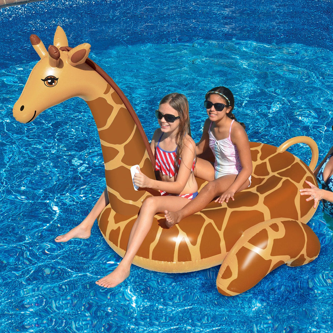 Kids and adults enjoying a vibrant giant inflatable giraffe pool float, ideal for summer water fun.