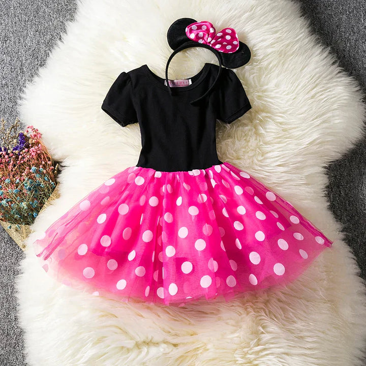 Adorable toddler Minnie Mouse costume set, featuring a red polkadot dress and iconic bow headband.