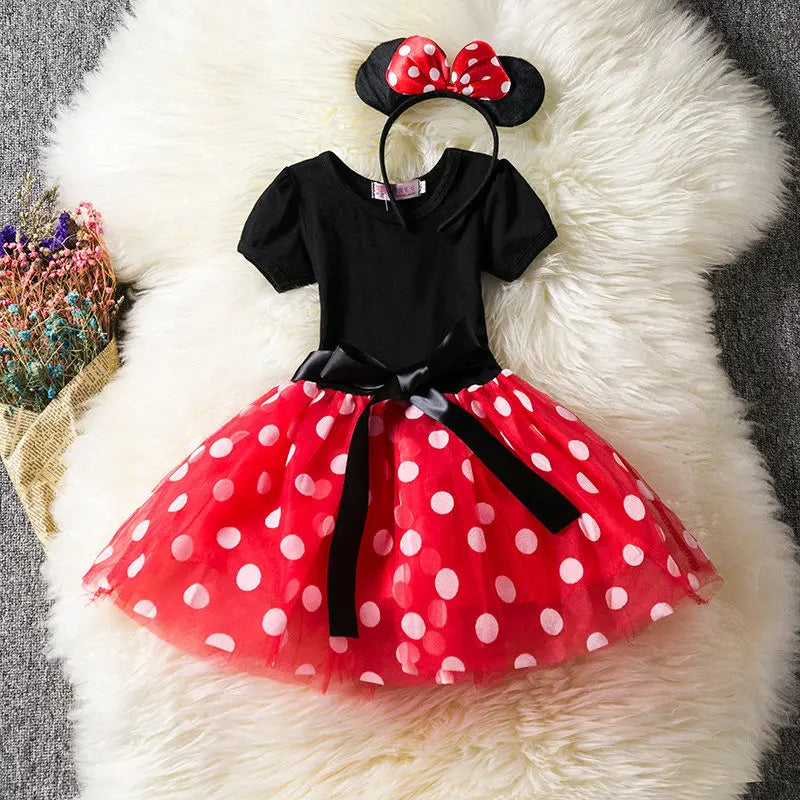 Girls' Minnie Mouse birthday outfit: vibrant red polkadot dress, black bodice, and cute bow headband.